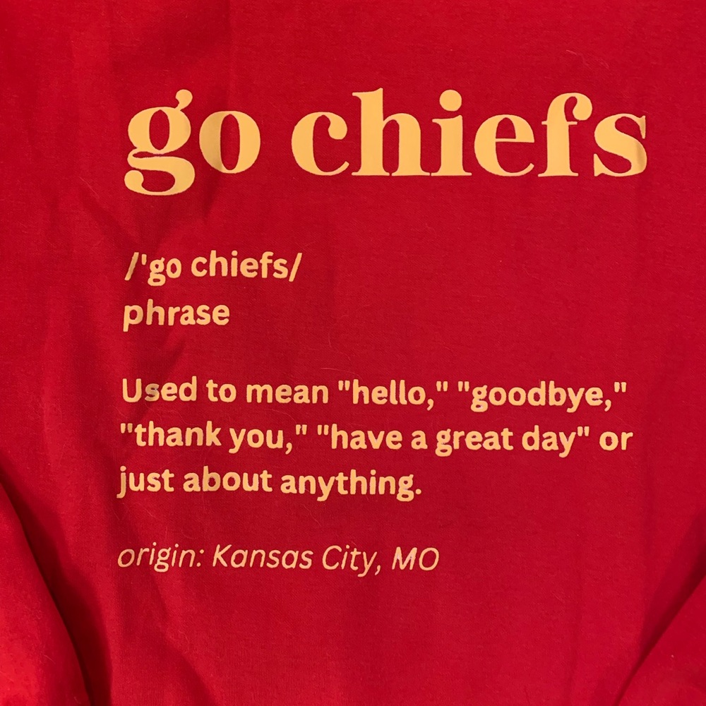 Red “Go Chiefs” sweatshirt.